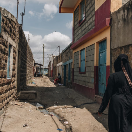 A woman walking in a neighborhood