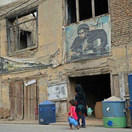 Two children walking on a street in Afghanistan