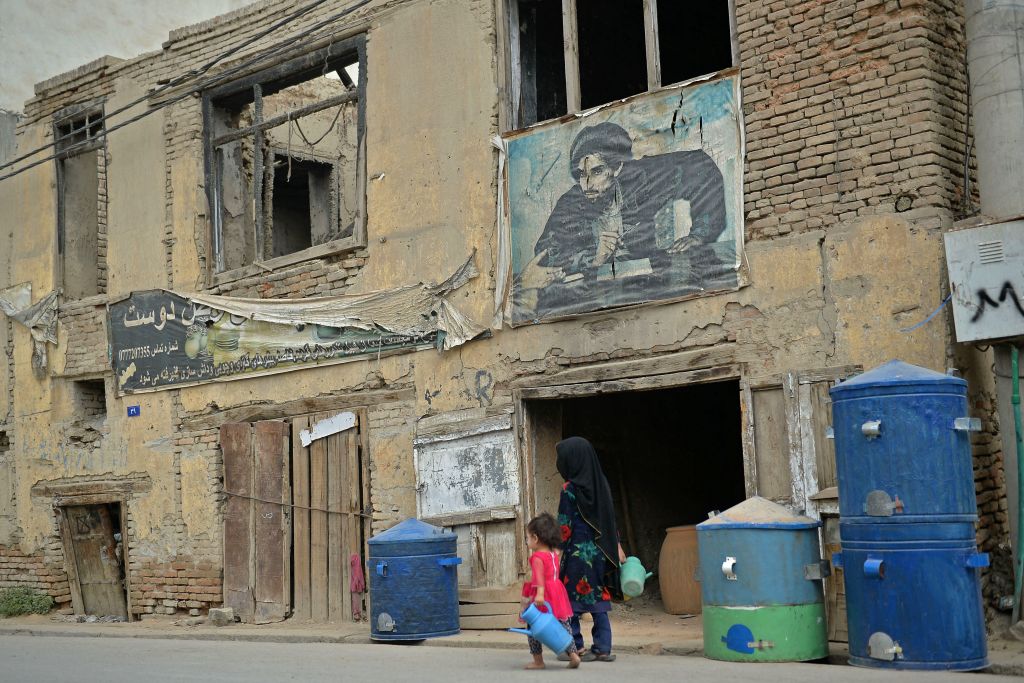 Two children walking on a street in Afghanistan