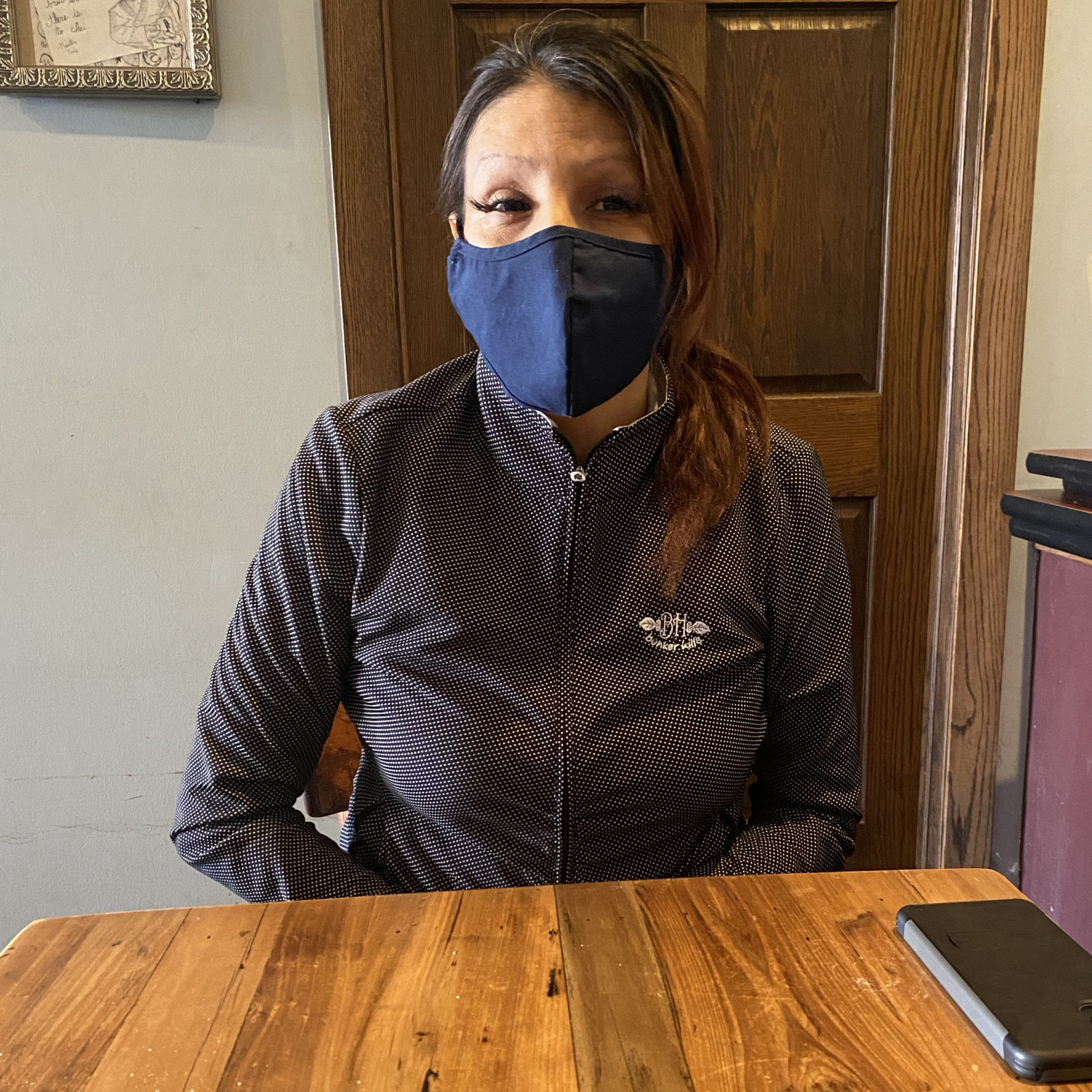 Photo of a woman seated at a table