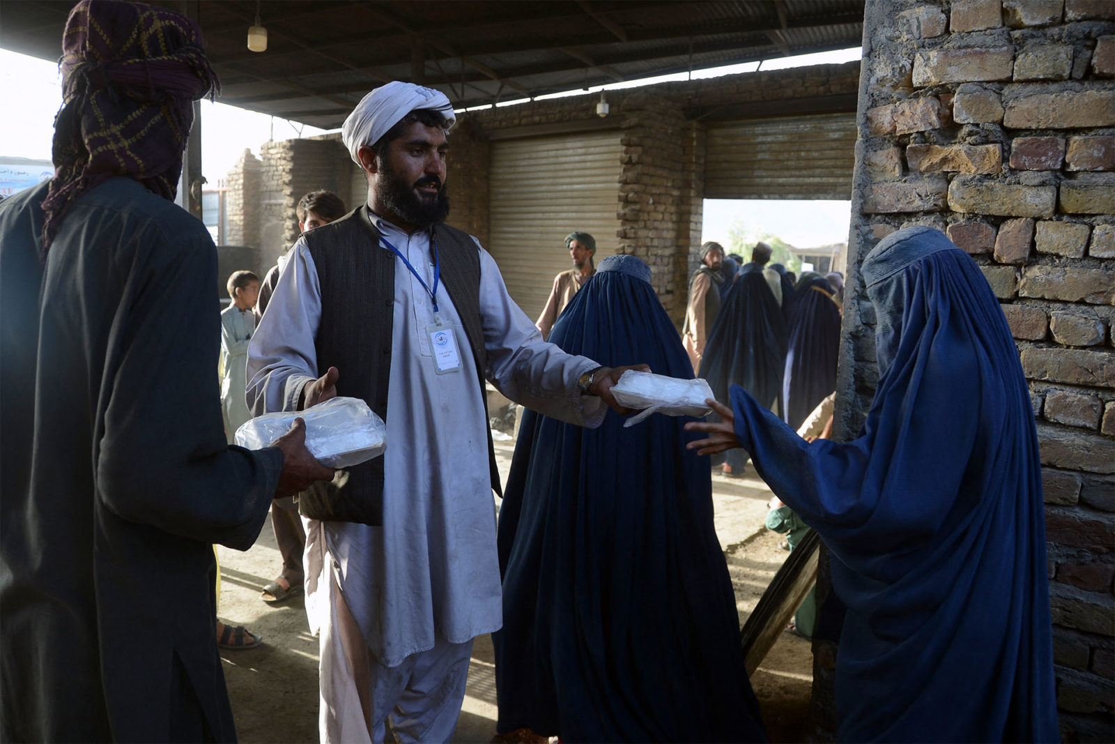 Photo of a woman receiving food from a charity