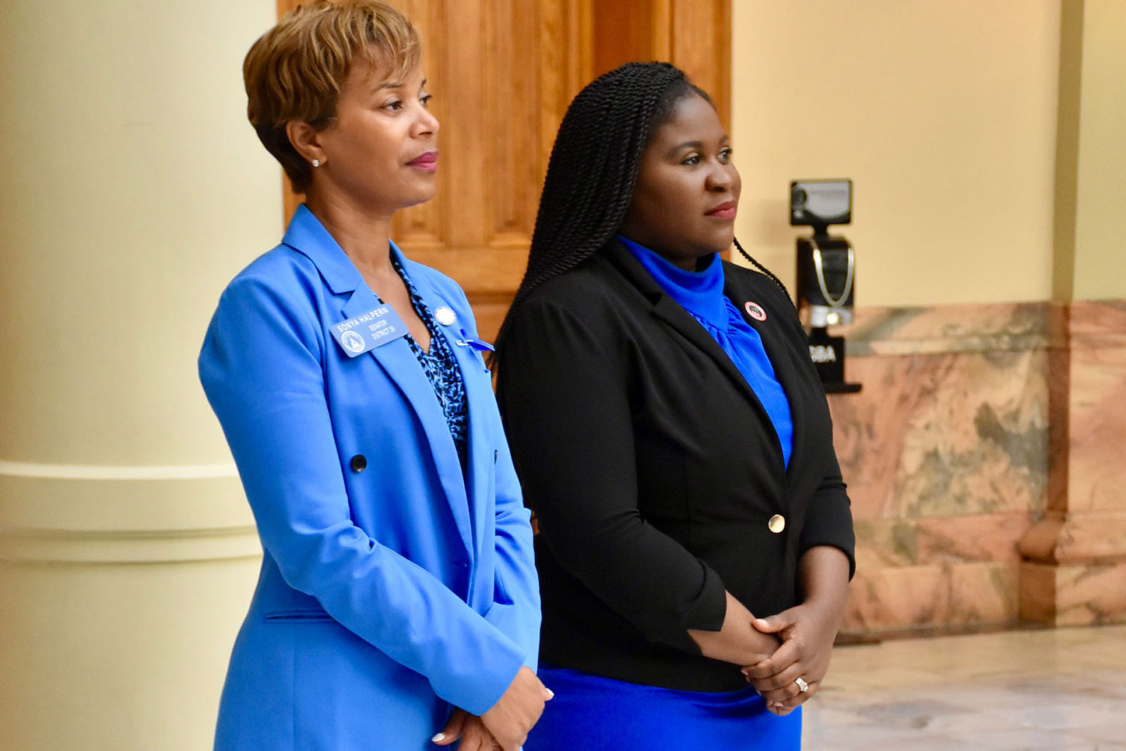 A photo of two women standing side-by-side