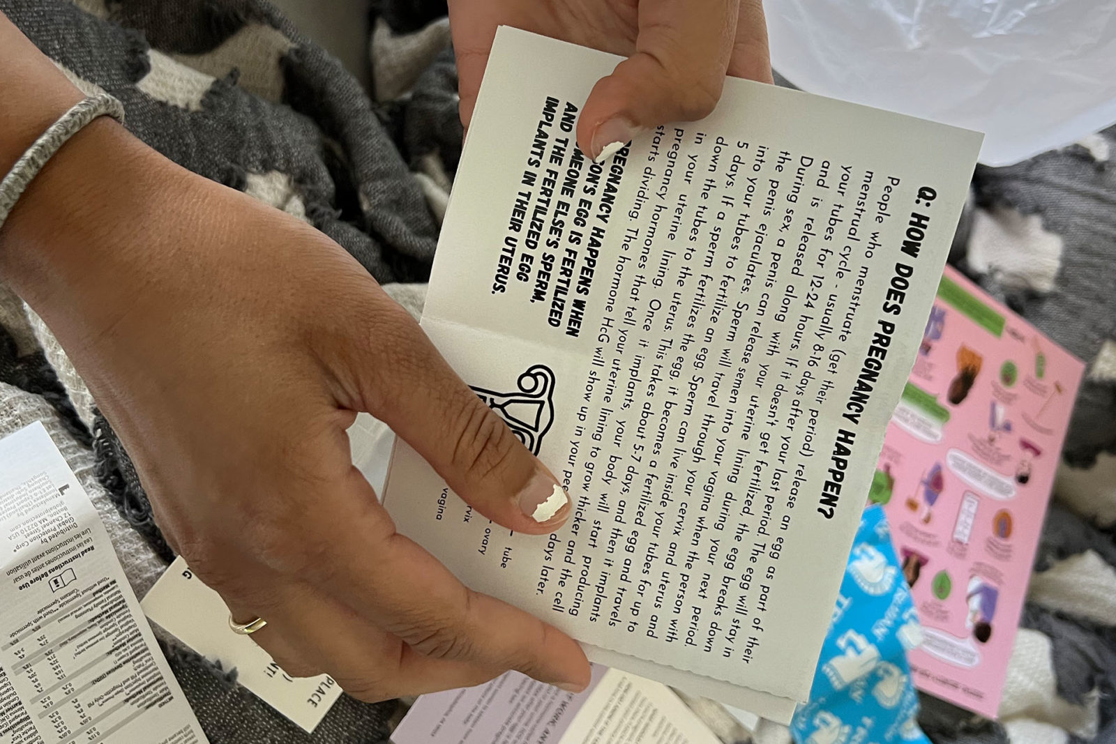 A photo of a person holding a pamphlet