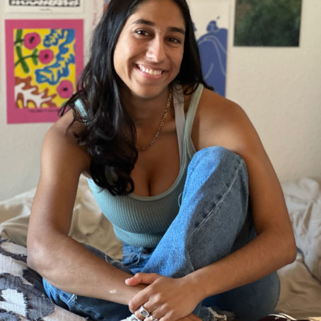 Photo of a person posing on a bed