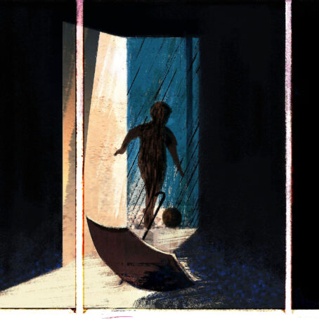 An umbrella laying on the floor and a child running out a door kicking a ball