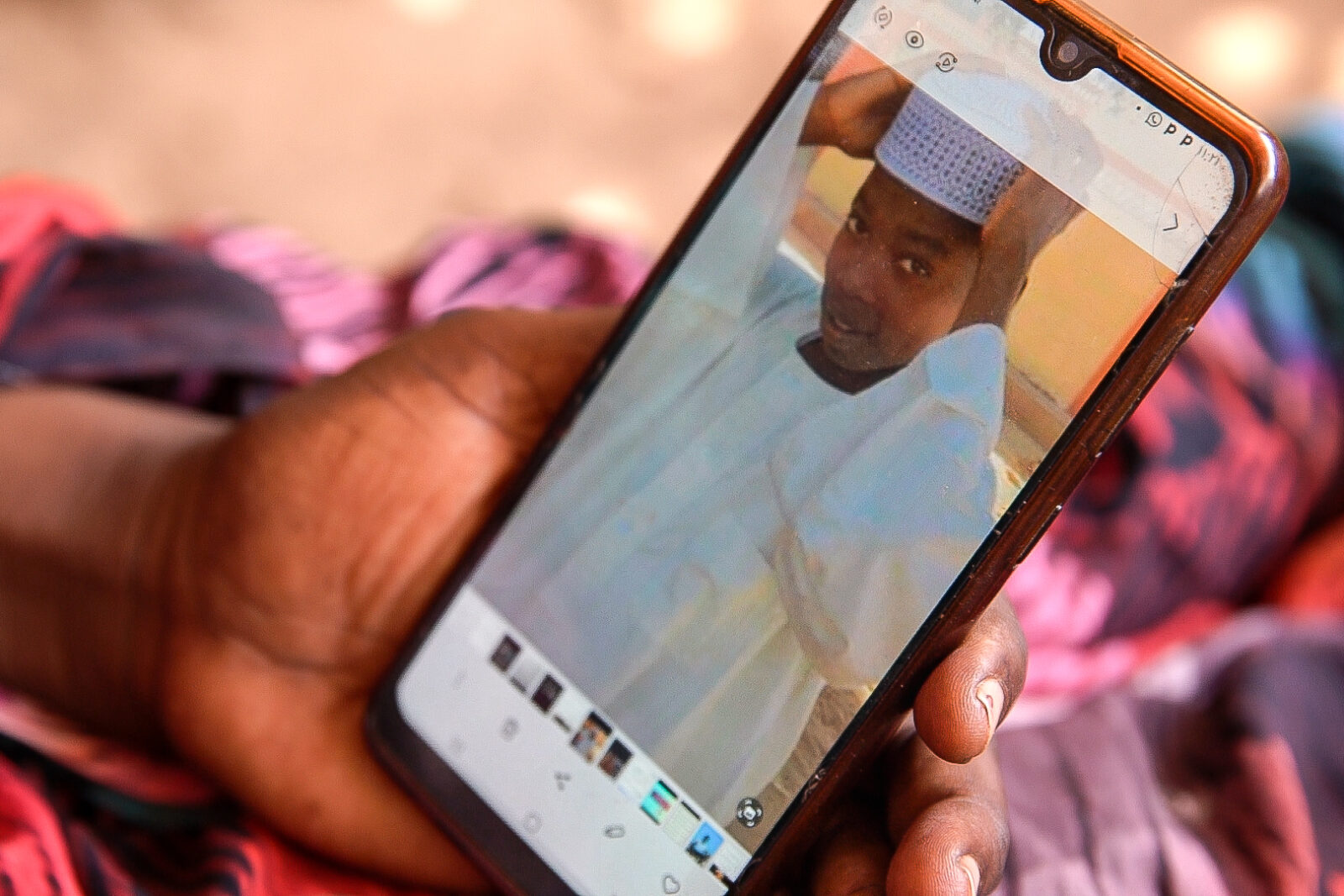 Zahra Khamis displays a picture of her son, Farhar Rahman Abdallah, on her phone. (Photo by Zoë Flood/Foreign Policy)